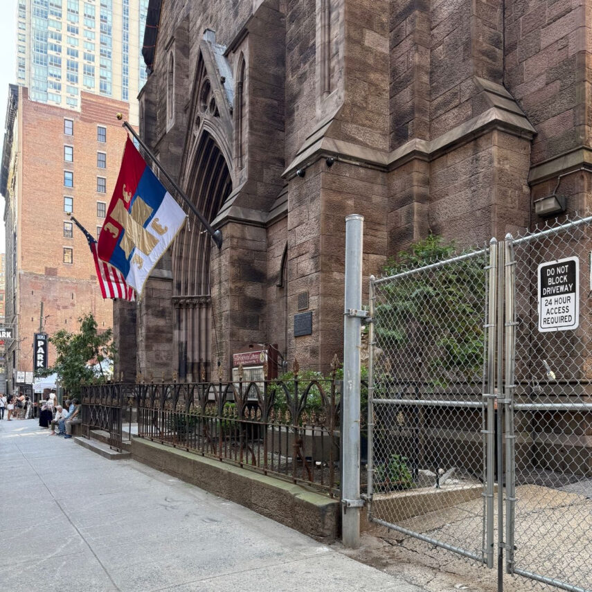 Sanding the Rusted Fence Around the Church